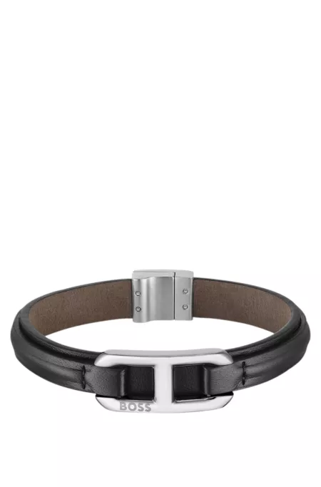 Brown-leather cuff with branded metallic link