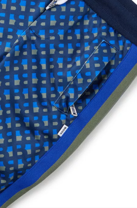 Kids' tracksuit bottoms with printed monograms