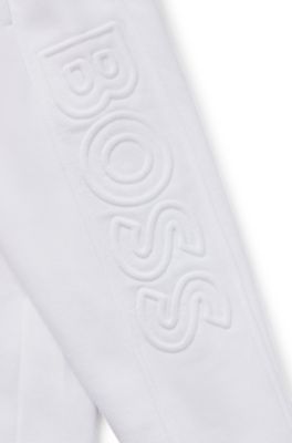 Kids' tracksuit bottoms with embossed logos, White