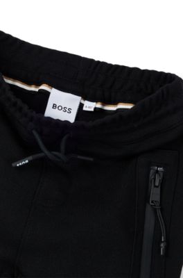 Kids' logo-detail tracksuit bottoms in stretch piqu&eacute;, Black
