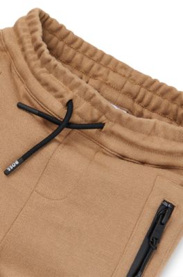 Kids' logo-detail tracksuit bottoms in stretch piqu&eacute;, Brown