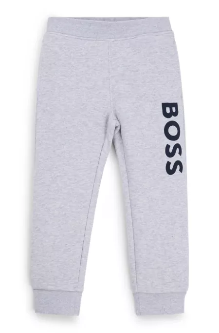 Kids' fleece tracksuit bottoms with vertical logo print