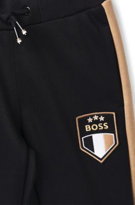 Kids' tracksuit with signature colour-blocking, Black