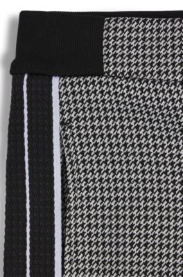 Pantalones de ch&aacute;ndal regular fit para ni&ntilde;os con motivo de pata de gallo, Gris