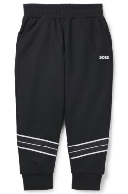 Pantalones de ch&aacute;ndal tapered fit para ni&ntilde;os con ribetes de espiga, Negro