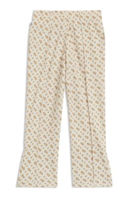 Pantalones de ch&aacute;ndal para ni&ntilde;os con estampado de monograma y cremallera en los bajos, Beige claro