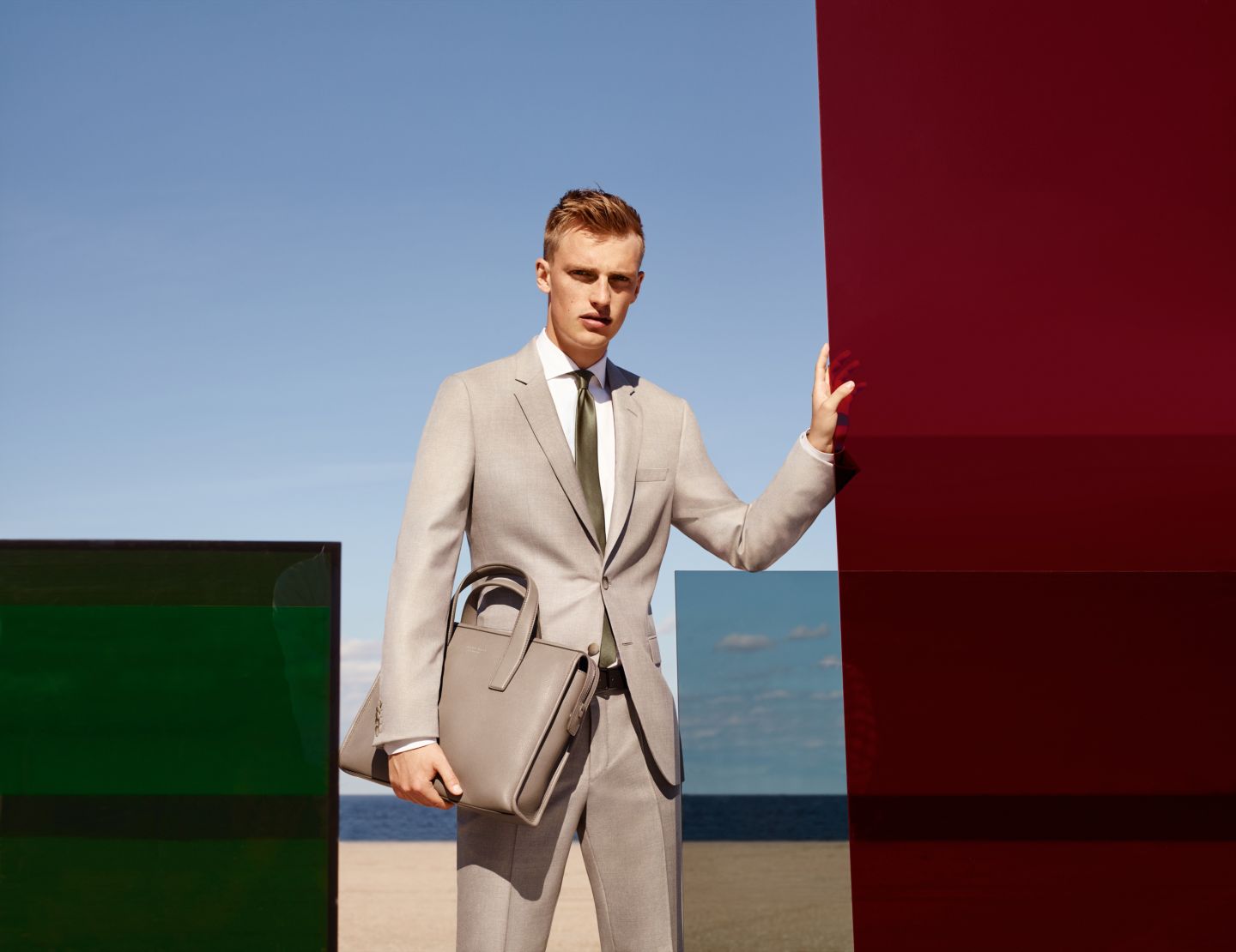 Men model, wearing beige suit