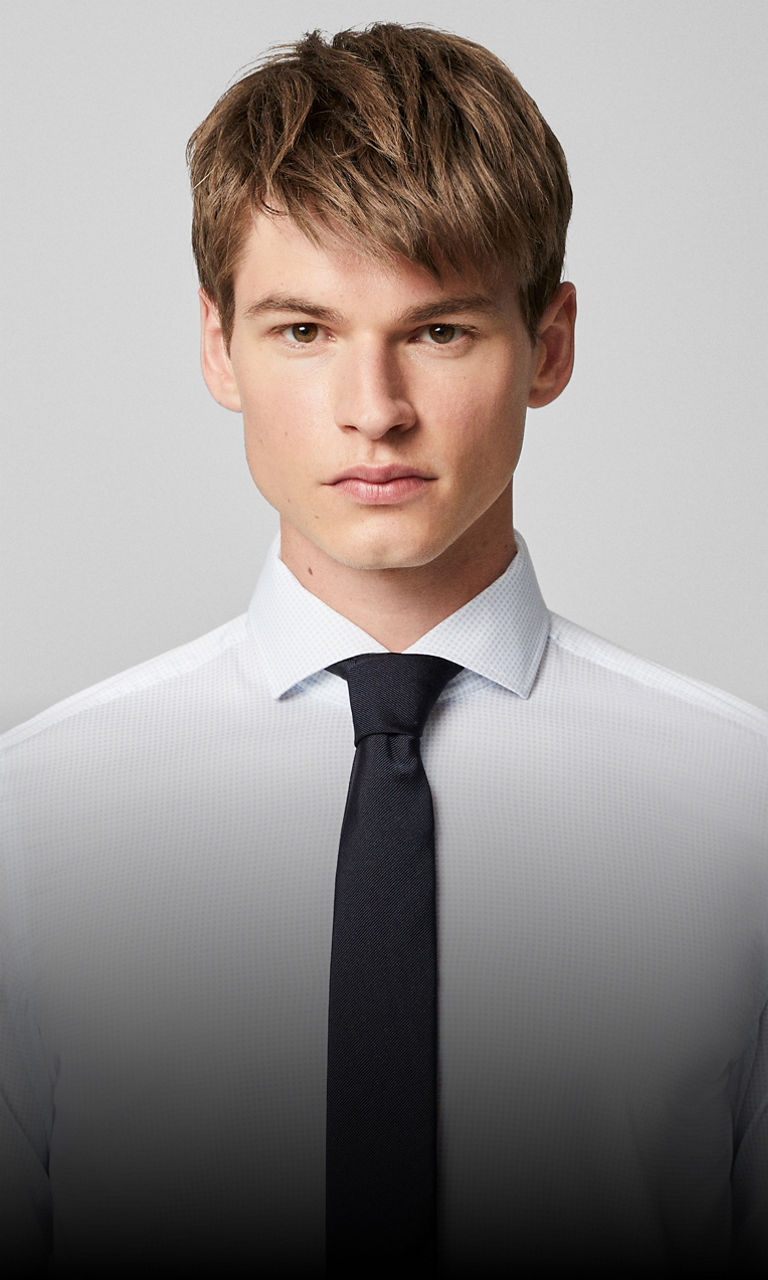 A picture featuring a men shirt with a spread collar