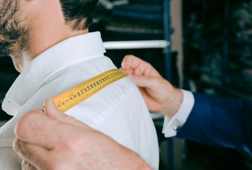 A man looking for his shirt size