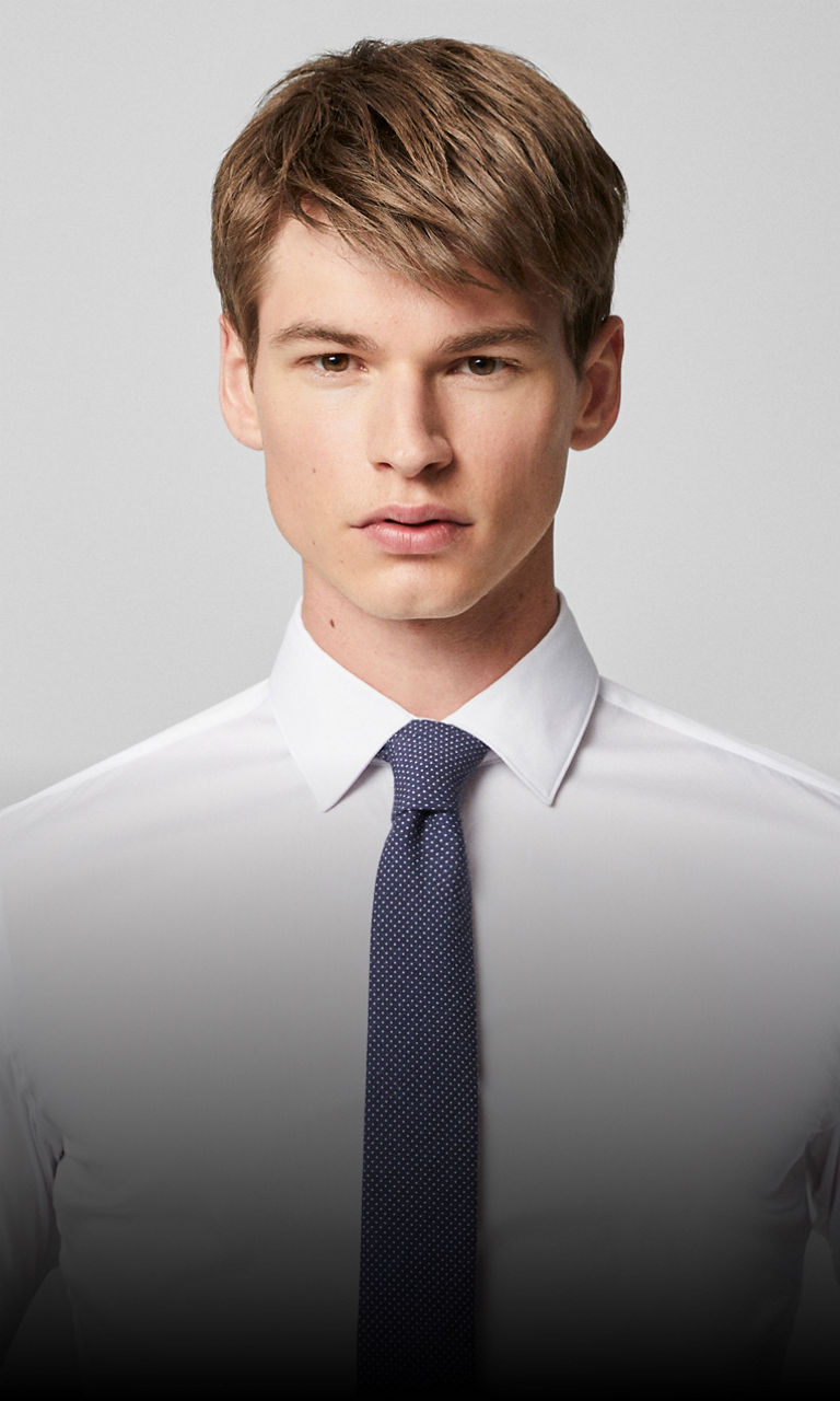 A picture featuring a men wearing a shirt with a kent collar