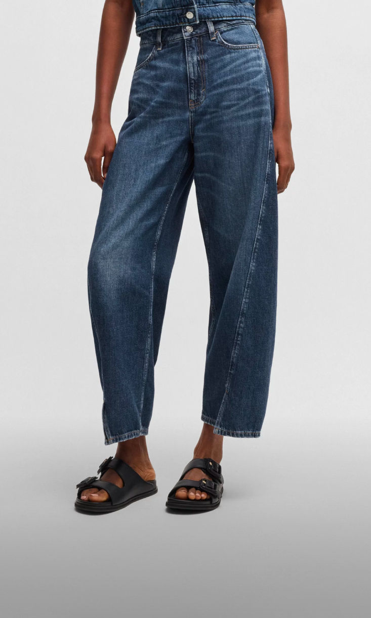 model wearing barrel fit denim 