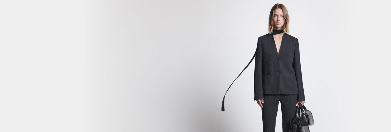 Beige blazer and shorts suit look for women