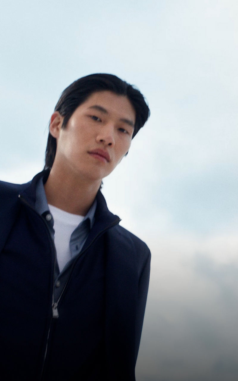 male model wearing the new BOSS Performance collection in navy blue.