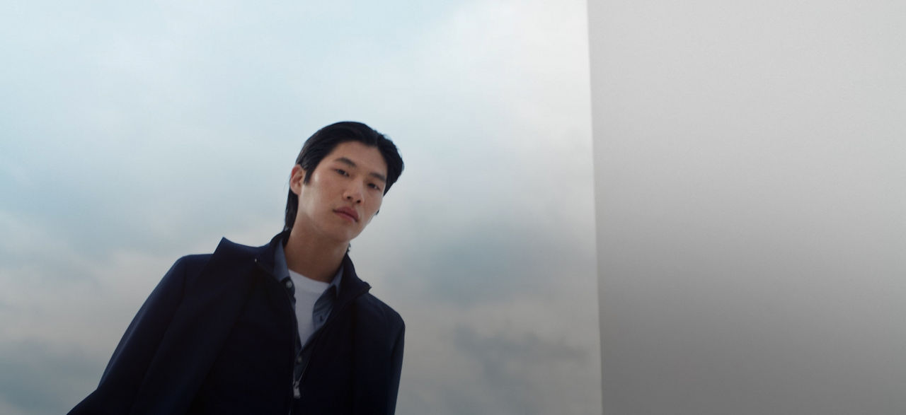 two male models showing off the new BOSS-Performance collection in navy blue.