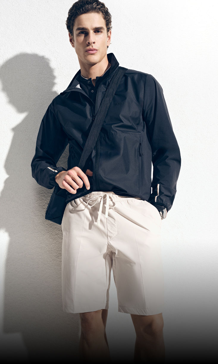 model wearing elevated athleisure wear with tennis racket by boss