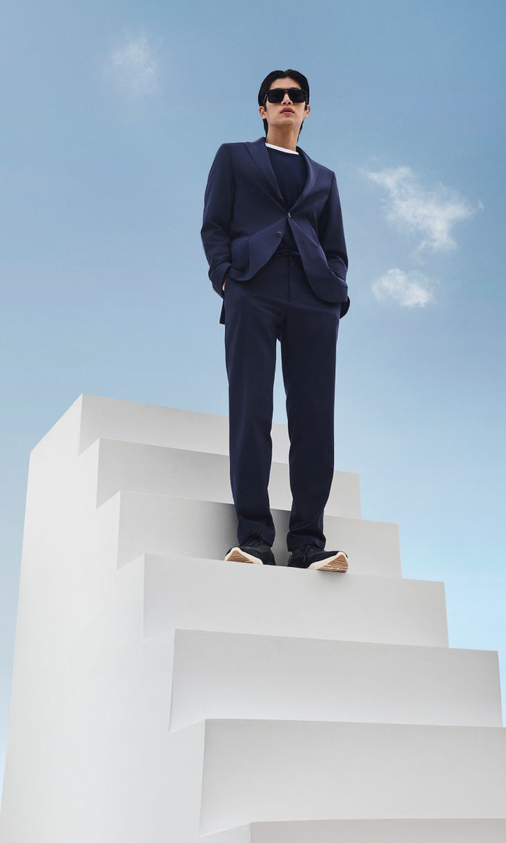 male model wearing BOSS Performance lightweight suit