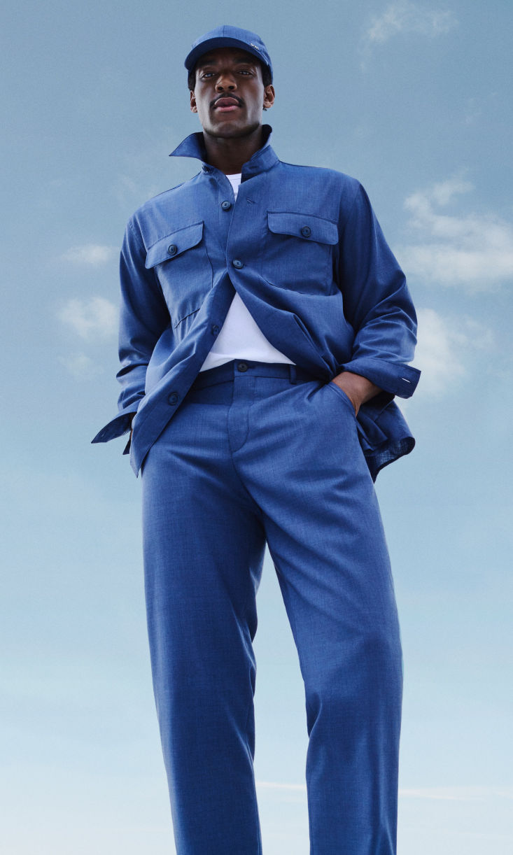 male model wearing BOSS Performance lightweight suit in open blue