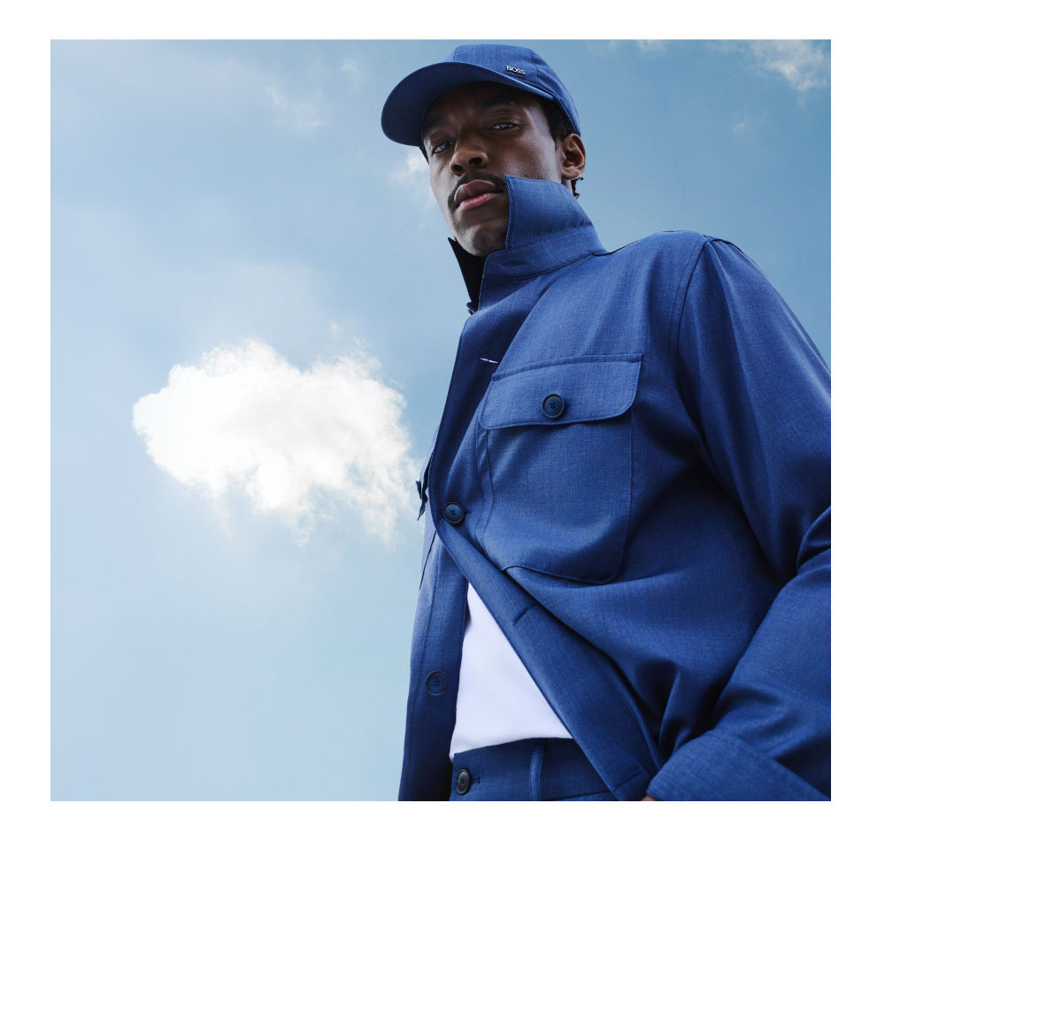 male model wearing BOSS Performance lightweight suit in open blue close up