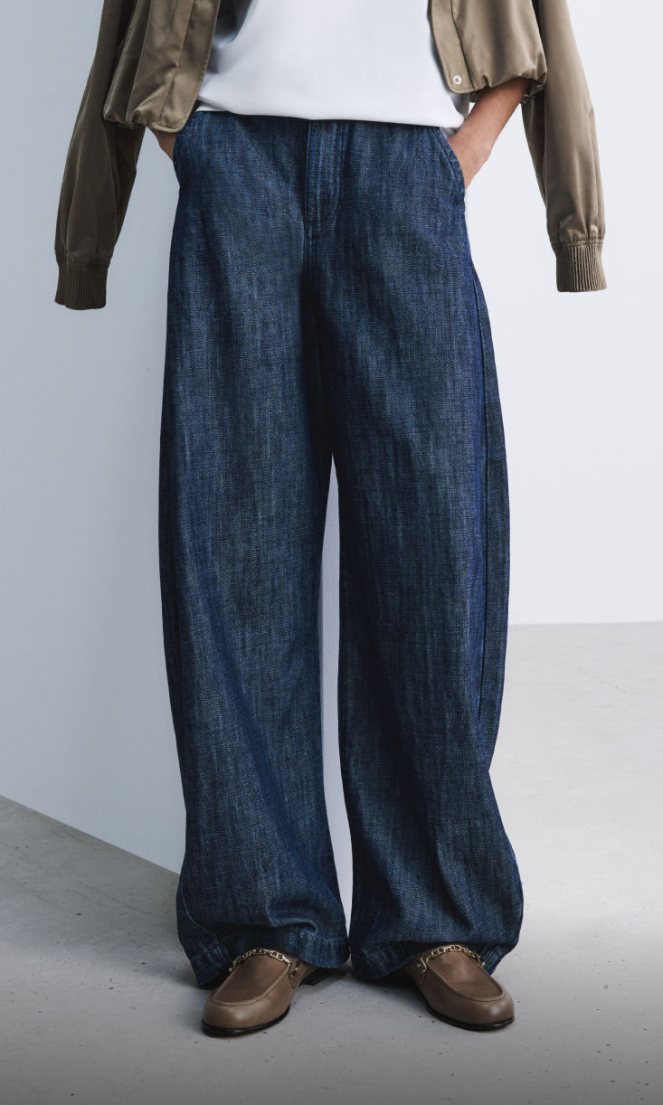 model wearing barrel fit denim 