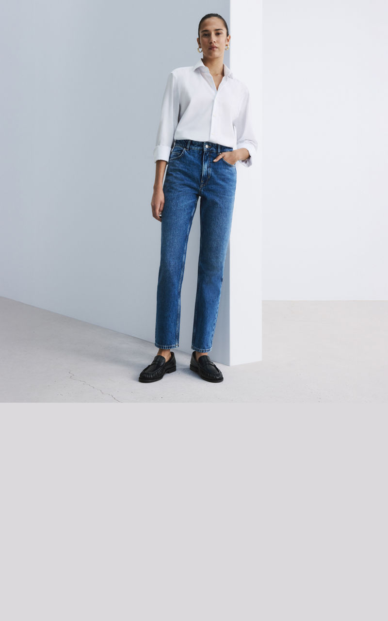 Model wearing a pair of straight fit jeans 