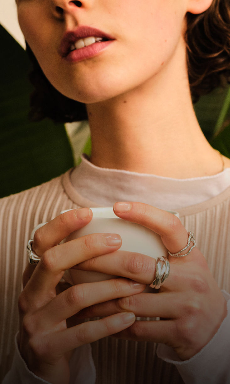 Women is holding a cup 