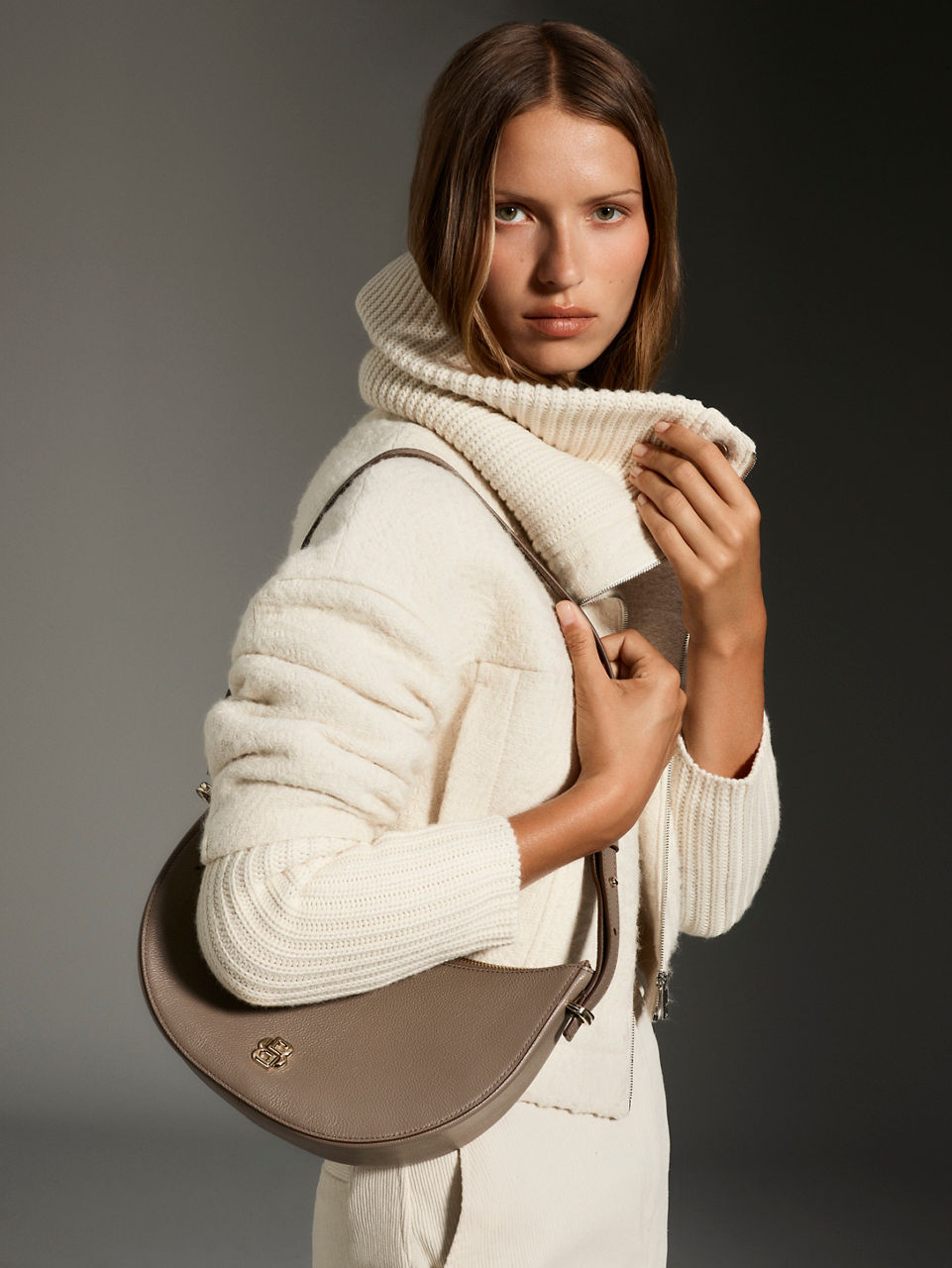 female model wearing red BOSS knitwear