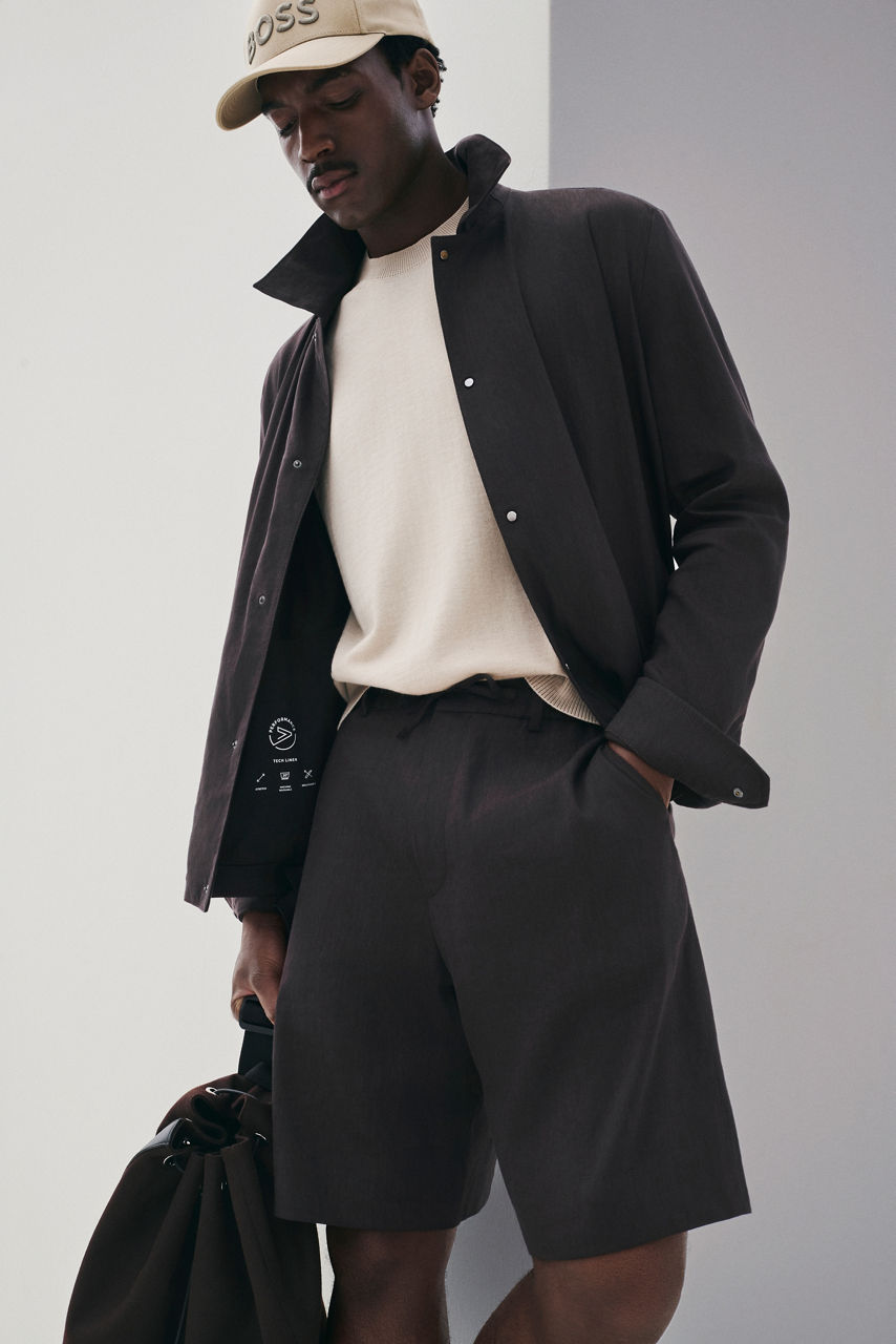 male model in the new BOSS Performance Tech Linen Look with a baseball cap