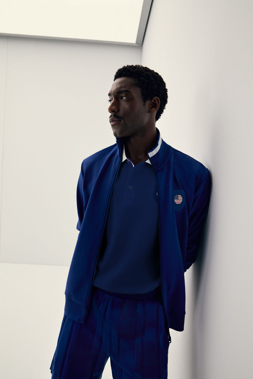 Male model wearing  dark green Zip Hoodie from our new NBA Collection