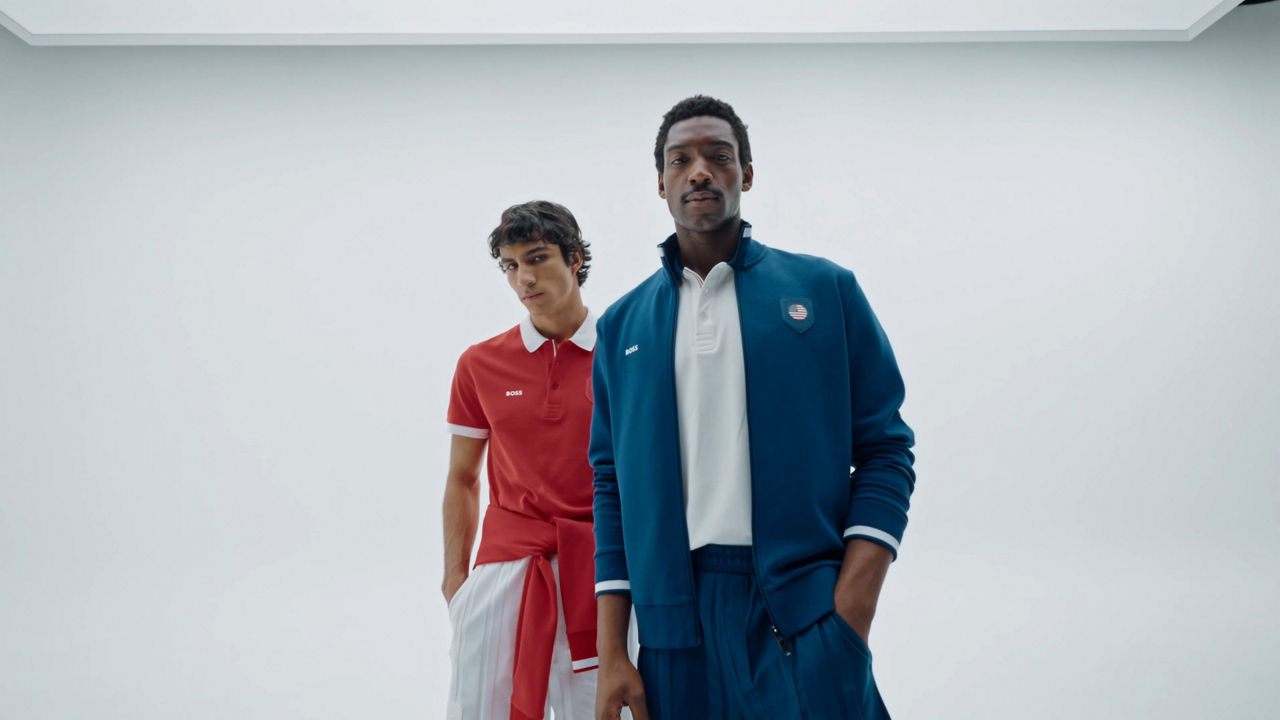 Male model wearing  dark green Zip Hoodie from our new NBA Collection