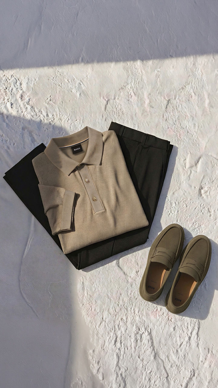 member exclusive products, male model presenting member exclusive outfits, sitting on a chair