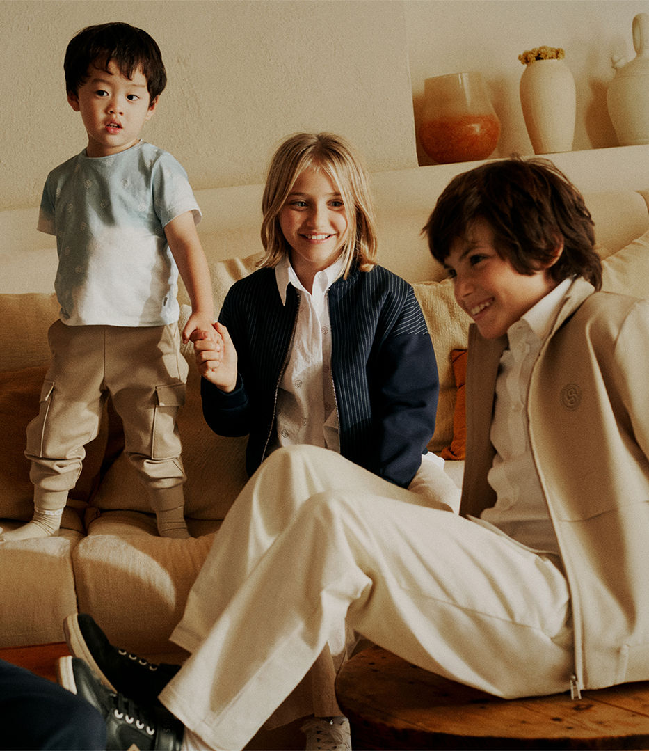 Boy and girl in BOSS Kidswear sweatshirts