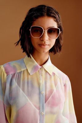 Female model wearing colourful dress and sunglasses for BOSS Women