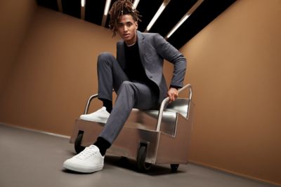 model wearing a grey packable suit