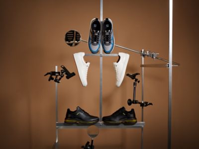 Laydown Image of grey/ blue trainers 