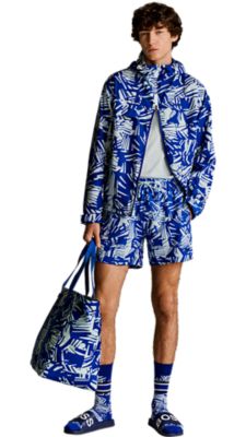 medium blue printed outerwear with a light blue polo shirt and a medium blue printed swimshorts and a big medium blue printed shopper bag for men by BOSSmedium blue printed outerwear with a light blue polo shirt and a medium blue printed swimshorts and a big medium blue printed shopper bag for men by BOSS