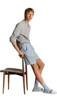 light blue knitted longsleeves poloshirt with a light blue T-shirt and a light blue shorts for men by BOSS 