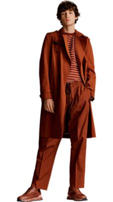 open brown midi trenchcoat with an open brown striped t-shirt and a wide fit cropped open brown trouser for men by BOSS 