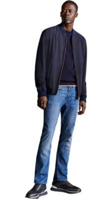 medium blue slim fit  jeans with da dark blue knit pullover and a dark blue bomber jacket for men by BOSS 