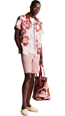 pastel pink chino shorts with a white t-shirt and a short sleeved pink shitw printed shirt for men by BOSS