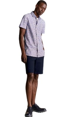 dark blue chino shorts with a meidum blue short sleeved shirt for men by BOSS