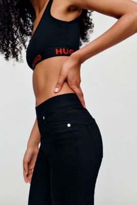 Female model is wearing a denim by HUGO