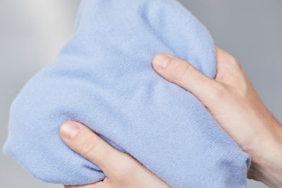 Hands feeling cashmere texture by BOSS