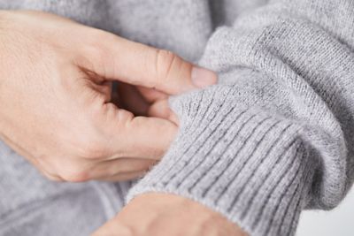 Close up sleeve of wool grey pullover by BOSS