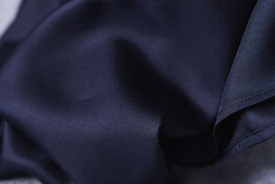 Dark blue silk fabric close up by BOSS
