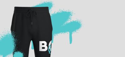 BOSS Limited Edition Graffiti collection and black trousers with graffiti displayed