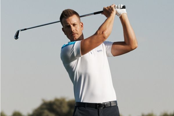 Professional golf player wearing polo T-shirt and trousers by BOSS